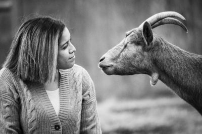 Erin Wing, Deputy Director of Investigations at the animal advocacy NGO Animal Outlook, spends time with Ginger at Wildwood Farm Sanctuary & Preserve.